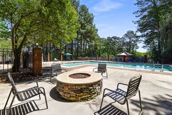 the preserve at ballantyne commons pool with chairs and a fire pit at 300 Riverside Apartments, Austell